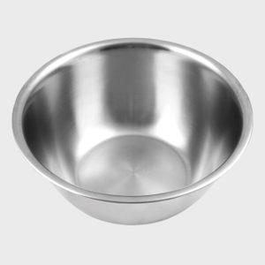 Stainless steel bowl sits empty on a light gray background, reflecting light from its smooth, shiny surface.