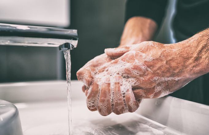 Coronavirus pandemic prevention wash hands with soap warm water and , rubbing nails and fingers washing frequently or using hand sanitizer gel.