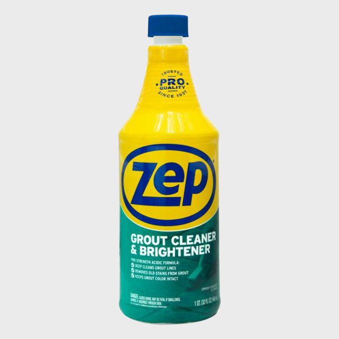 A bottle stands upright featuring Zep Grout Cleaner and Brightener branding, with a yellow top and text detailing its uses in cleaning grout.