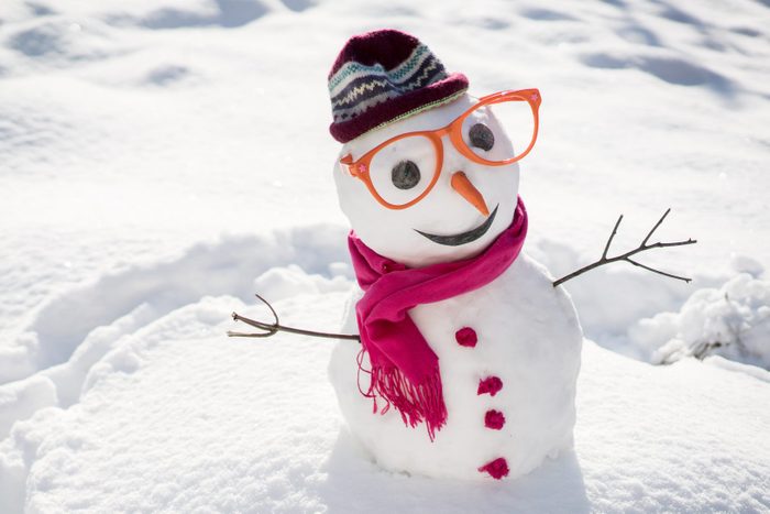 Winter snowman on snow