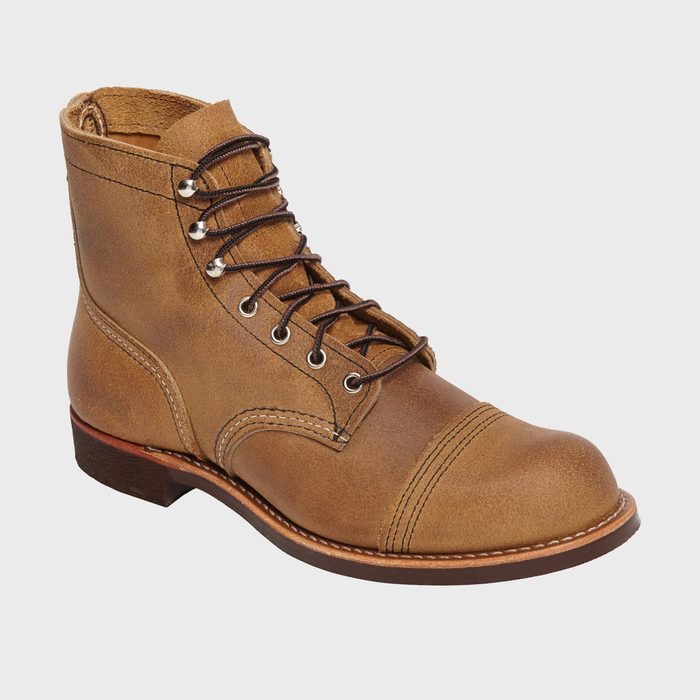 Brown leather boot laced tightly, displayed against a plain white background.