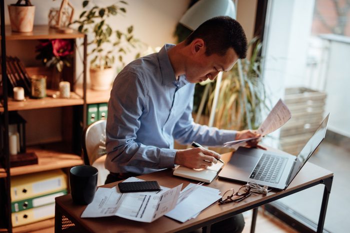 Man calculating his financial bills