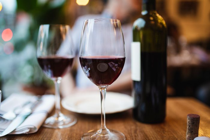 two glasses of red wine on table at a restaurant