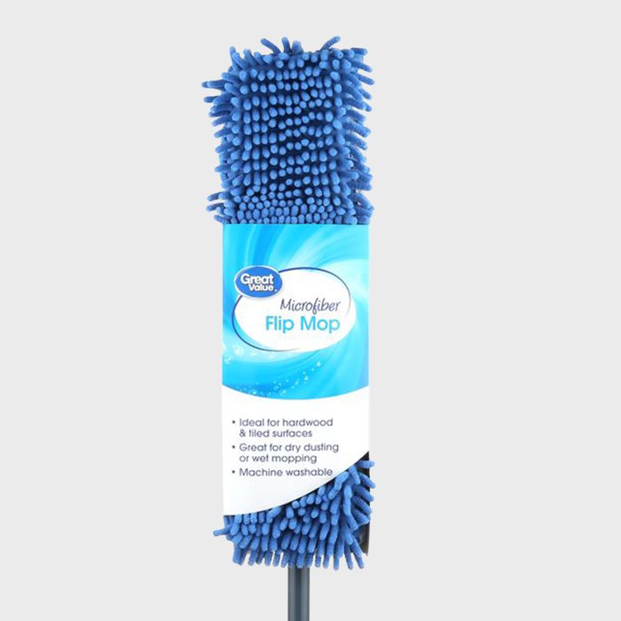 Blue microfiber mop resting upright against a plain background with text describing its features: ideal for hardwood surfaces, dusting, and machine washable.