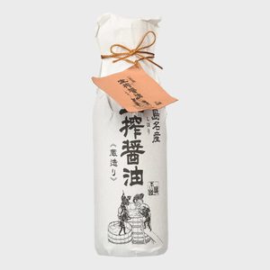 A bottle wrapped in white paper, tied with a gold string; features Japanese text and an illustration of two figures working with a barrel.