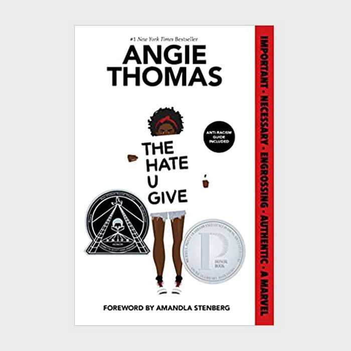 Book cover shows a character holding a sign. Title 