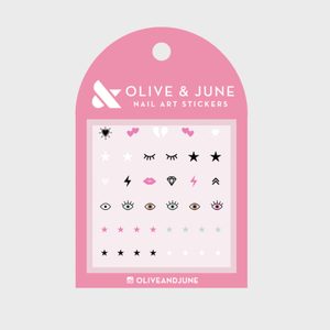 Nail art stickers arranged in rows, featuring hearts, stars, eyes, and lightning bolts, on a pink card labeled 