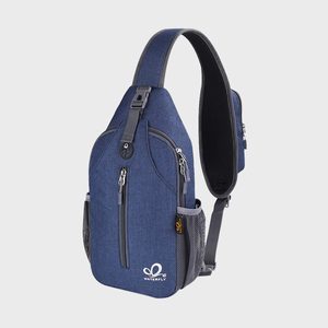 Sling bag in blue fabric, featuring multiple zippered compartments, with mesh side pockets; displayed against a plain white background.