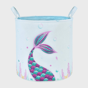 Fabric storage basket features a colorful mermaid tail, surrounded by sea plants and bubbles, with handles on a light background.