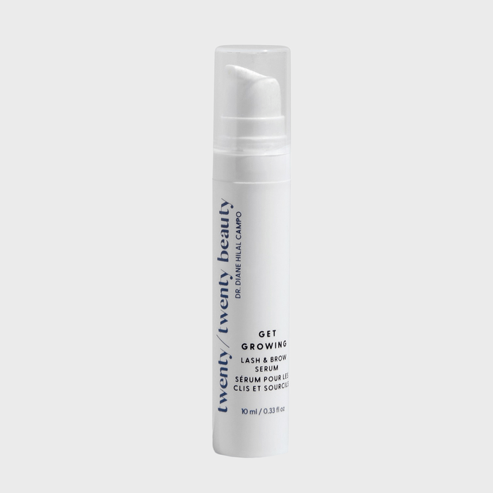 A white serum bottle with a pump dispenser labeled 