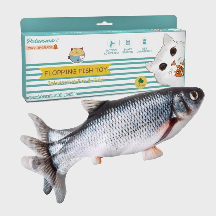 Fish toy flops on a surface; surrounded by packaging box with text: 