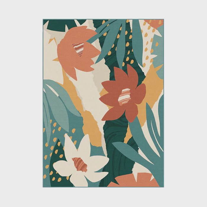 Colorful flowers and leaves arranged dynamically on a rectangular surface with abstract patterns, featuring shades of orange, green, white, and teal.