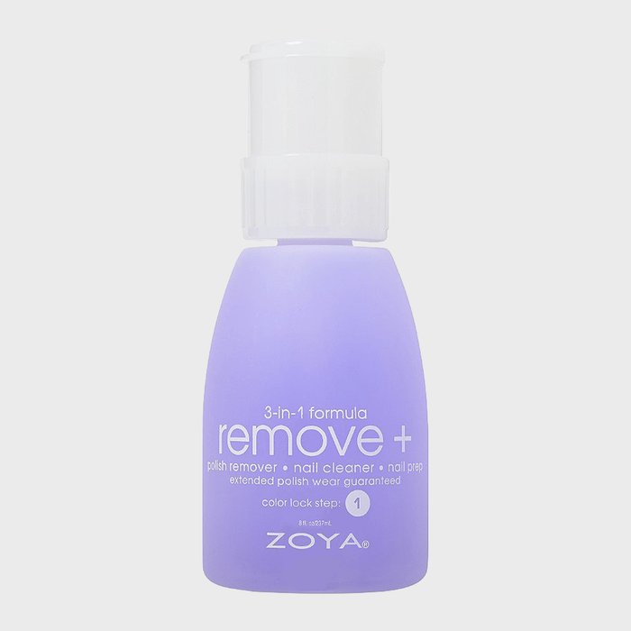 Purple bottle sits upright, labeled 
