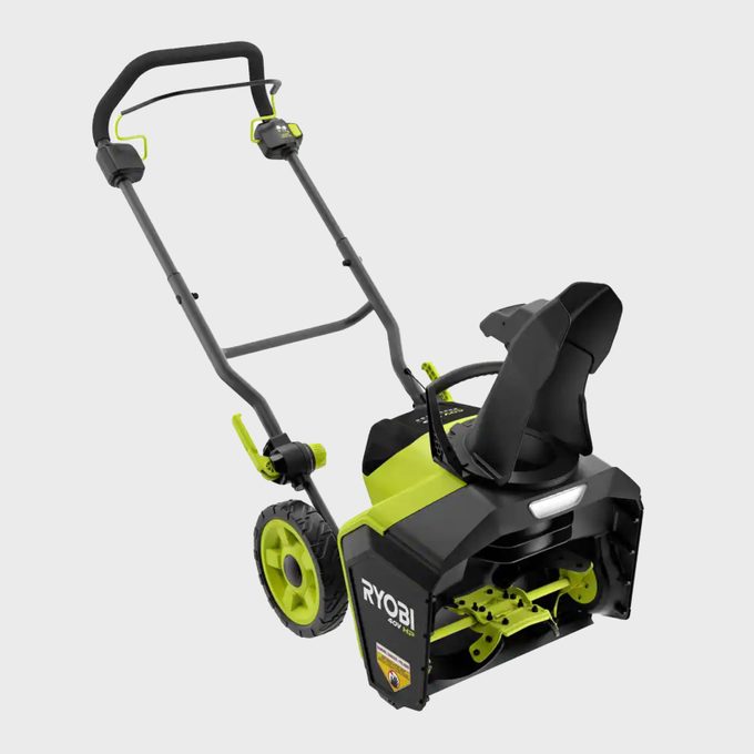 Snow blower angled forward, featuring a chute and two wheels, resting on a plain white background. Text: 