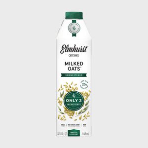 Carton of unsweetened oat milk stands upright, featuring claims: 