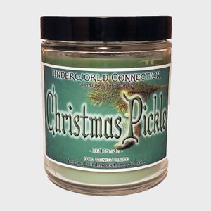 A green jar candle labeled 