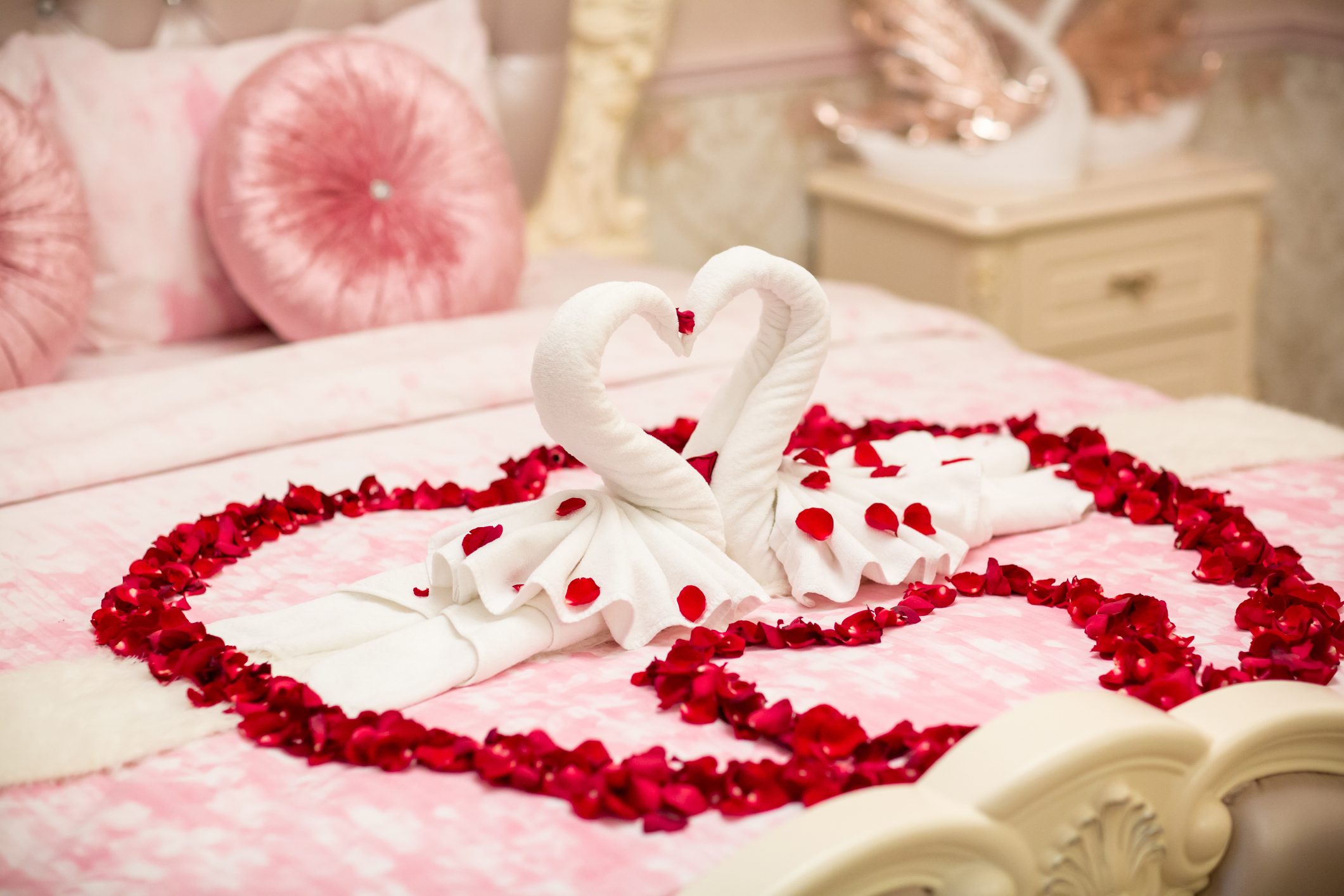 two towel swans shaped on the bed,Honey moon bed.Honeymoon