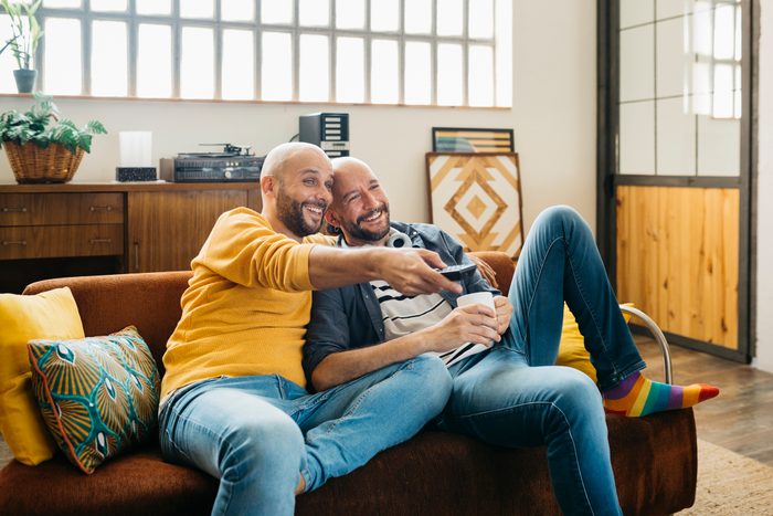 Gay couple relaxing on a couch