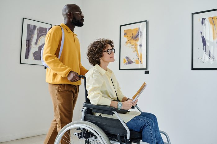Woman with disability enjoying modern art