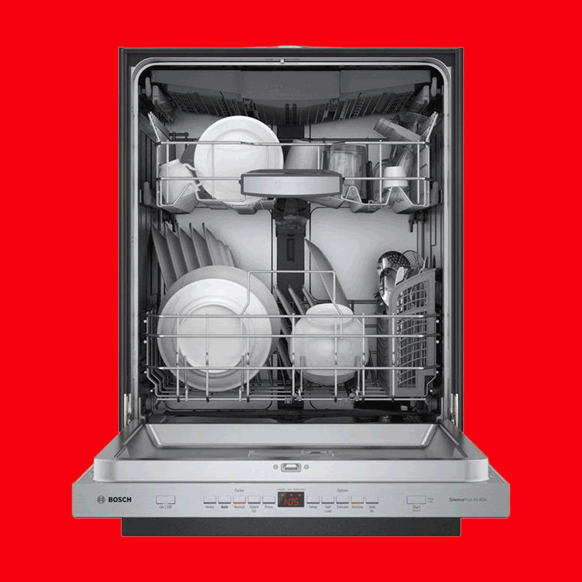 Open dishwasher displaying clean dishes and cutlery; plates, cups, and utensils are neatly arranged inside. The background is bright red, highlighting the appliance.
