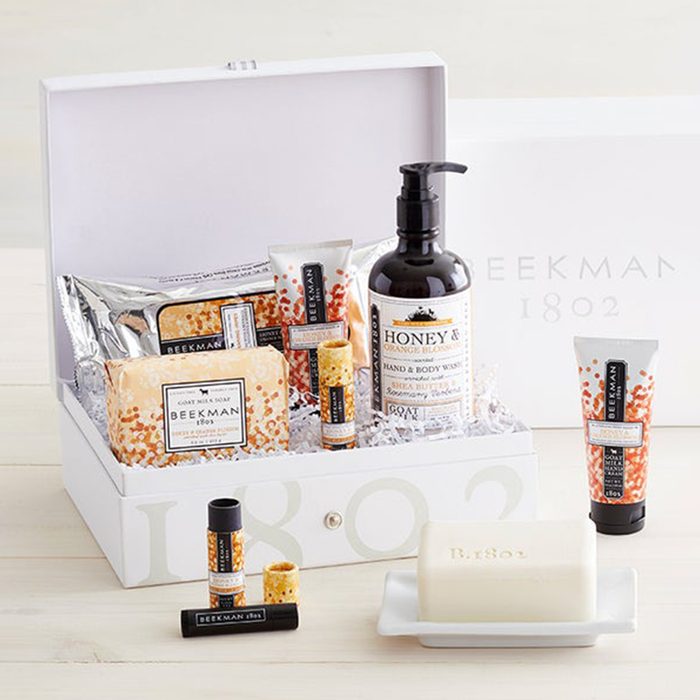Gift box holds skincare products including lotion, soap, and lip balm; all labeled 