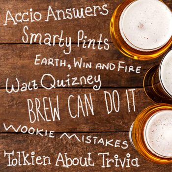 Beer glasses resting on a wooden table with playful quiz team names written in white chalk-like text, creating a playful trivia atmosphere.