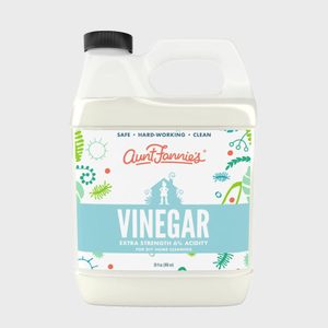 Plastic jug contains cleaning vinegar; label says 