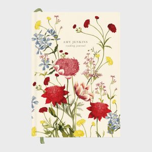 Journal cover displays colorful wildflowers, including red, yellow, and blue blooms, against a cream background. Text reads: 