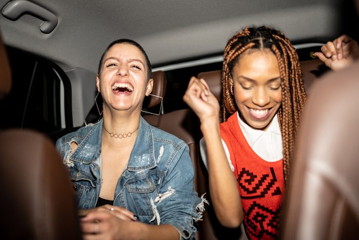 Friends singing in the car