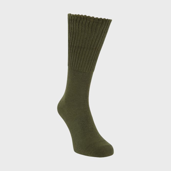 Green sock stands upright against a plain, light gray background.