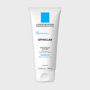 Tube displays skincare product label, standing upright against a neutral background, detailing 
