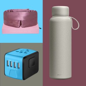 Silk sleep mask rests on a pink box, gray water bottle stands upright, blue-black universal adapter sits beside them. Text: 
