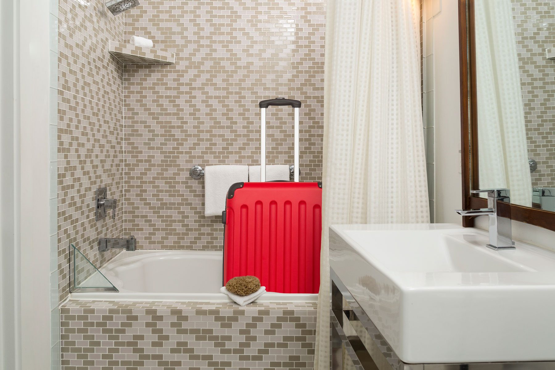 Here’s Why You Should Put Luggage in Your Hotel Room’s Bathtub