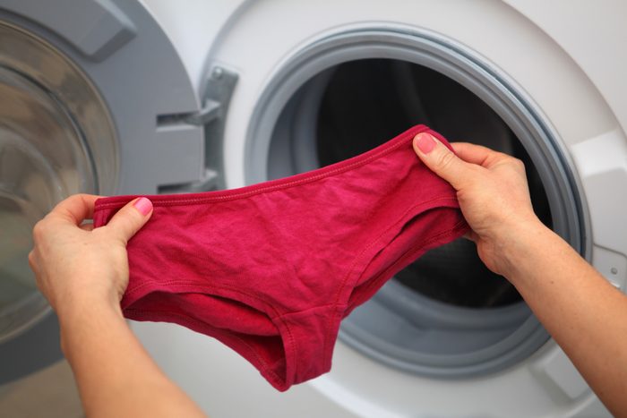 shorts in hands for laundry