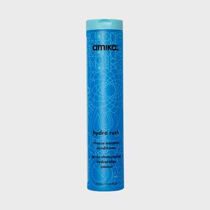 A blue cylindrical bottle stands upright, adorned with intricate geometric patterns. Text reads: 