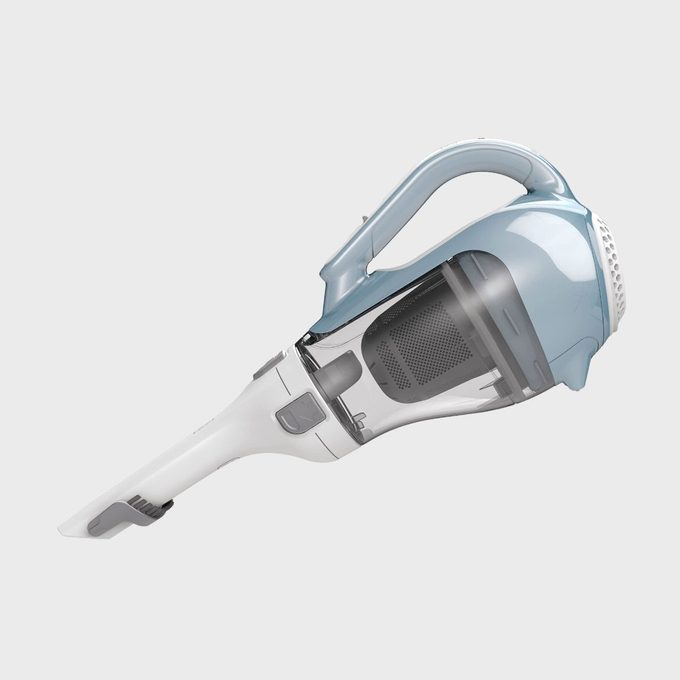 Handheld vacuum, angled sideways, with a sleek design featuring a transparent dust compartment, pale blue accents, and a gray nozzle, set on a white background.