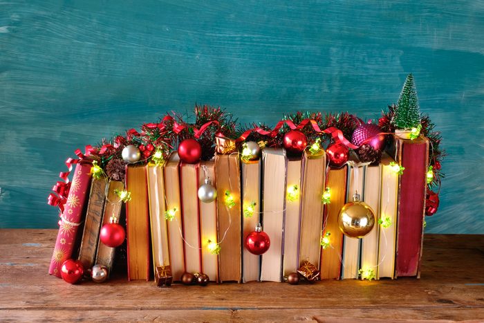 giving books for christmas,books as christmas gift,christmas present,reading,literature,education,making a gift concept, copy space
