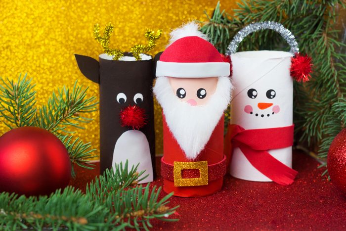 Handmade craft project from toilet tube. Creative kids DIY New year. Cute Snowman, Deer, Santa Claus for Christmas party