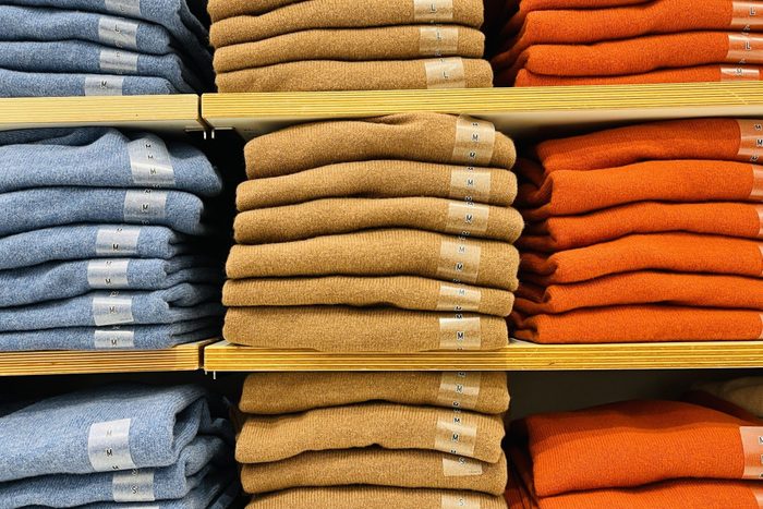Close up of Colorful Shirts on shelf in a shop