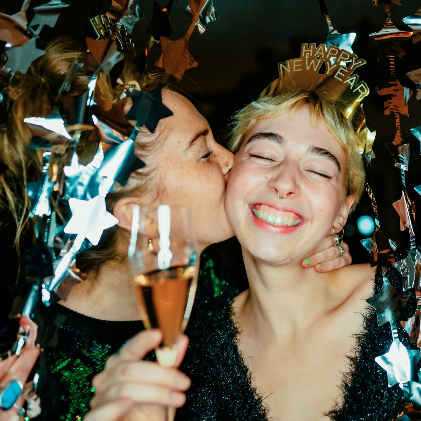 Friends celebrating New Year's with champagne