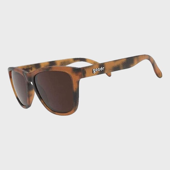 Tortoiseshell sunglasses rest at an angle, displayed against a plain white background. The brand name 