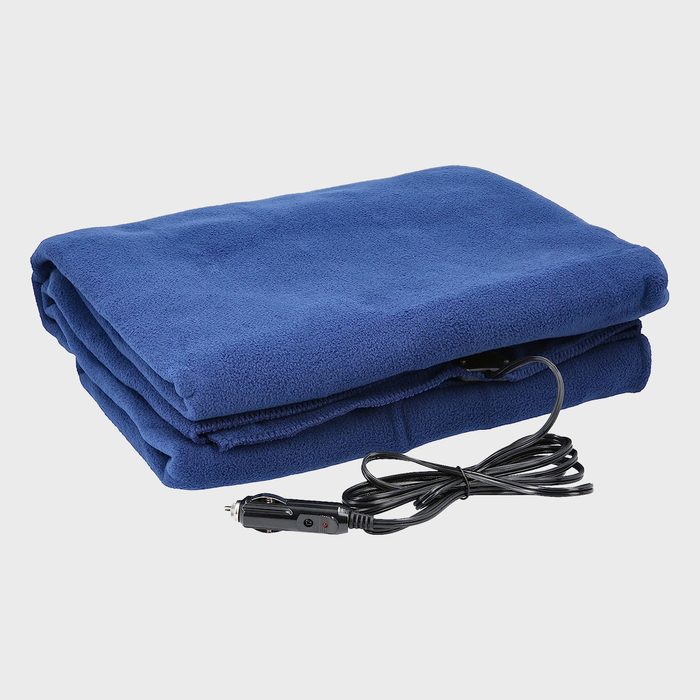 Blue electric blanket lies folded, attached to a power cord. Cord features a plug, suitable for vehicle use, in a plain, neutral setting.