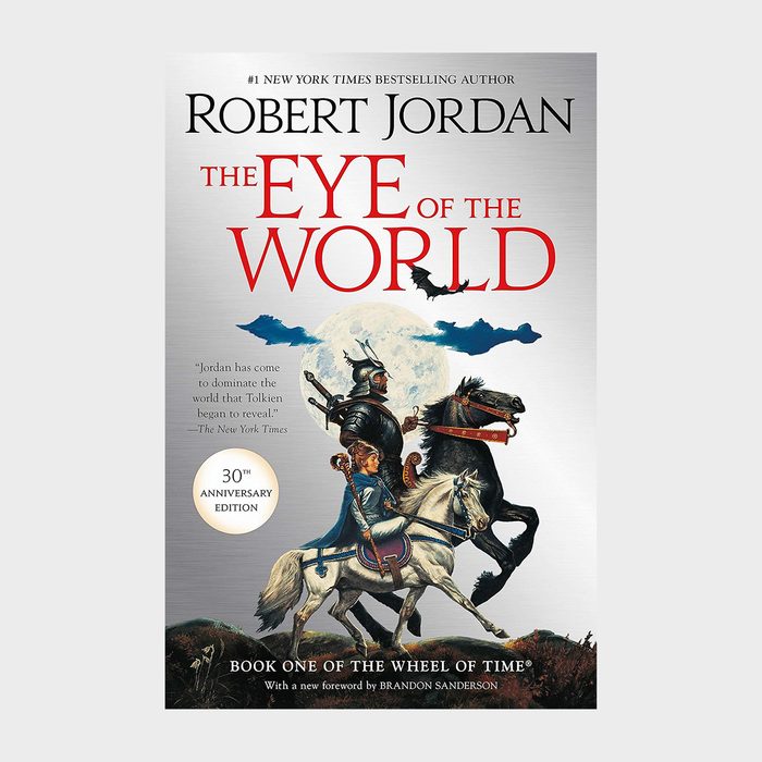 Knight rides a horse alongside a woman under a full moon, with bold title text and author 