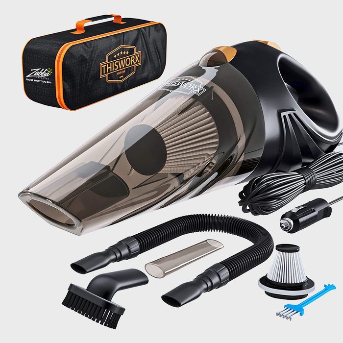 Car vacuum cleaner set includes attachments and a carrying bag; designed for car interiors, featuring a coiled power cord and various nozzle tools.