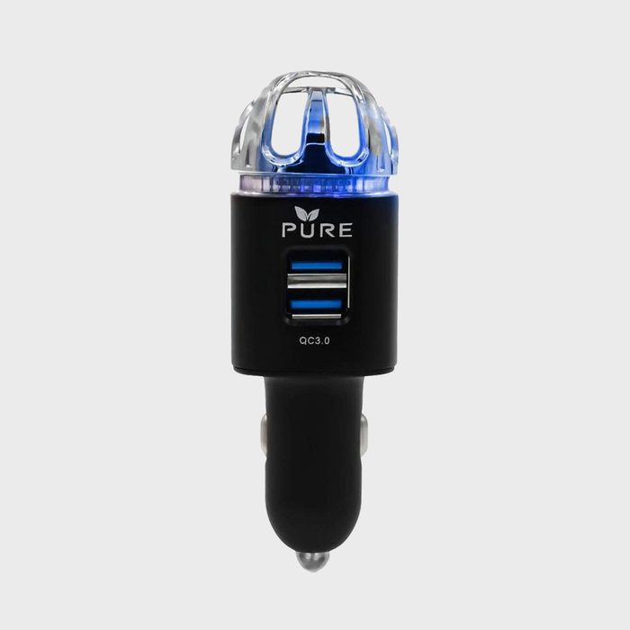A black car charger with dual USB ports glows blue, featuring 