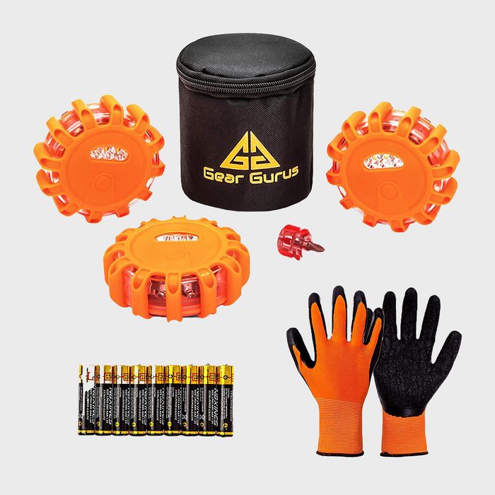 Emergency kit with three orange LED flares, cylindrical black case labeled 