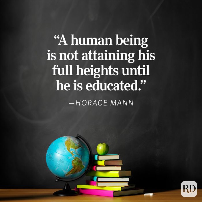 A globe rests on a table with stacked books and an apple, set against a blackboard displaying a Horace Mann quote about education.