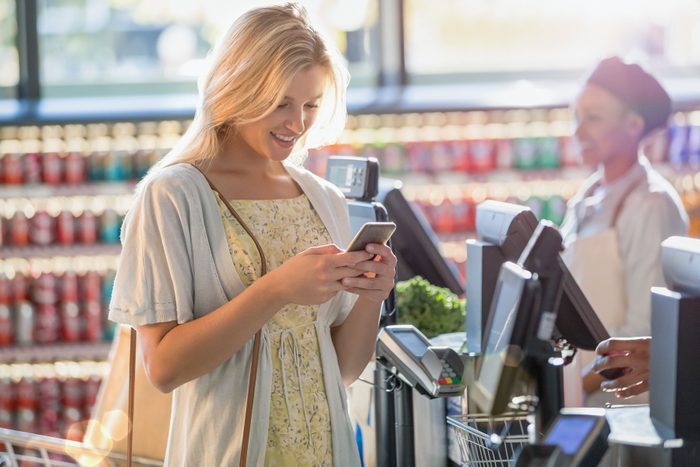 Talking on your phone during checkout