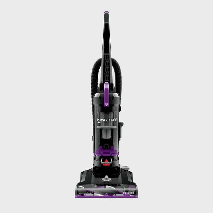 Vacuum cleaner stands upright; designed for household cleaning; features 