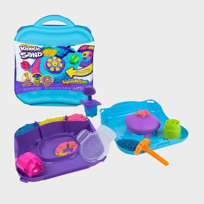 Kinetic sand set includes colorful molds and tools on a blue and purple tray, with packaging displaying vibrant sand creations.